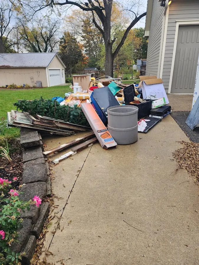 Dumpster being loaded with debris for Commercial Dumpster Rental in Greenwich
